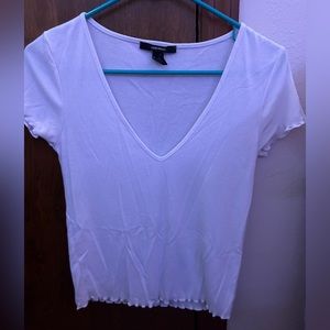 White V-neck top